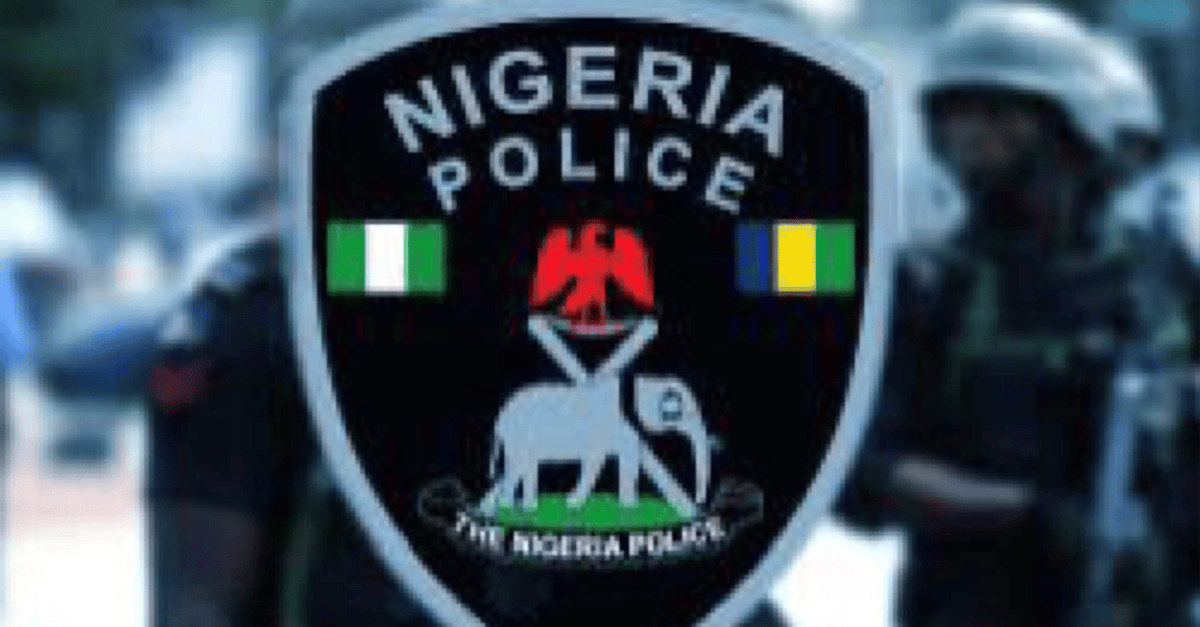 Katsina police officers at a checkpoint with seized weapons