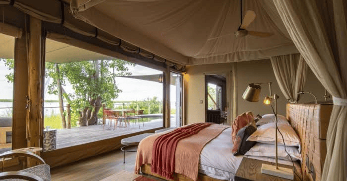 Luxury hotel exterior in Africa with palm trees and pool