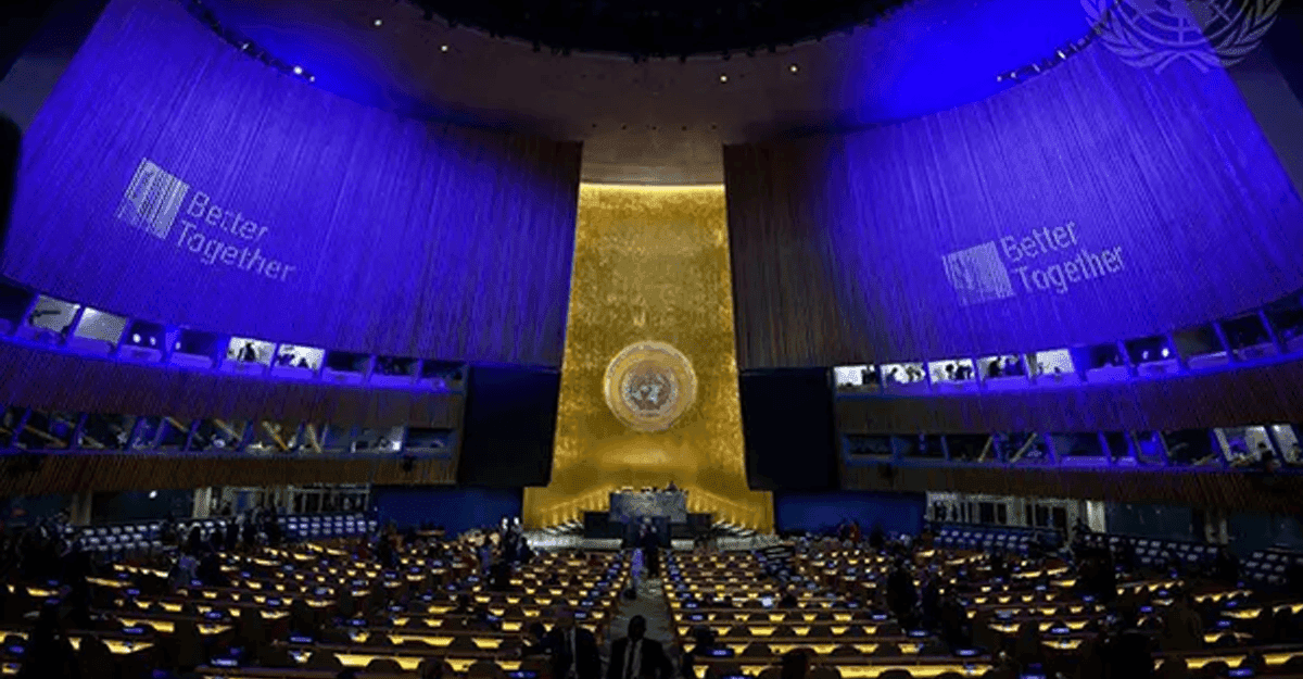 Nigerian flag at UN headquarters, with delegates in foreground