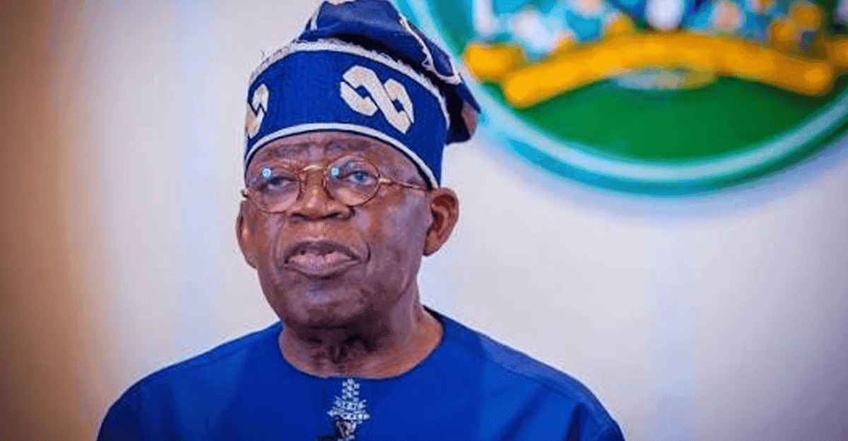 President Bola Tinubu speaking at a podium in Nigeria