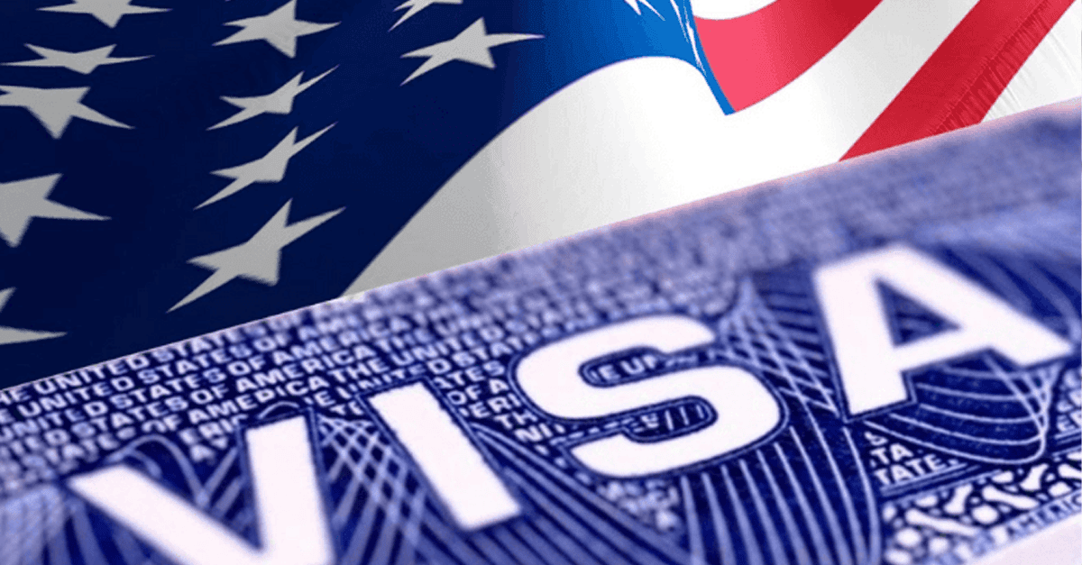 U.S. embassy in Abuja with Nigerian flag, visa application scene