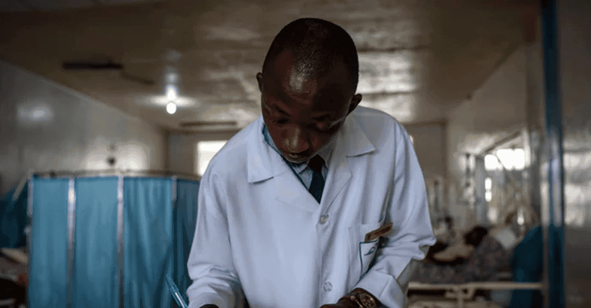 Nigerian doctor using digital health app in a clinic