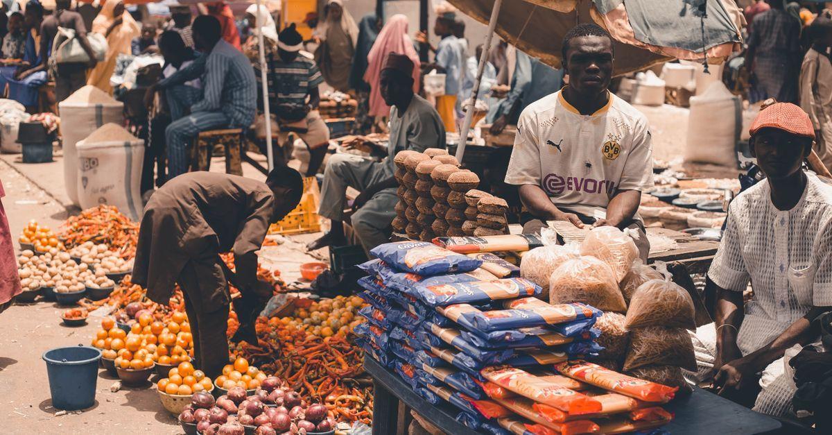 Nigerian market with fresh produce and price tags